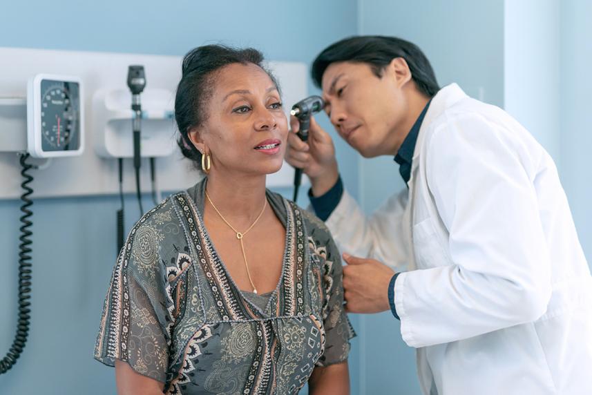 Doctor checking a patients ear