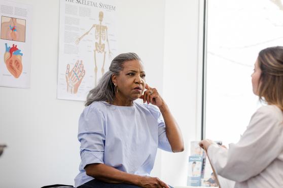 A woman talking to a doctor