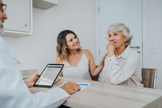 Two women talking to a medical professional